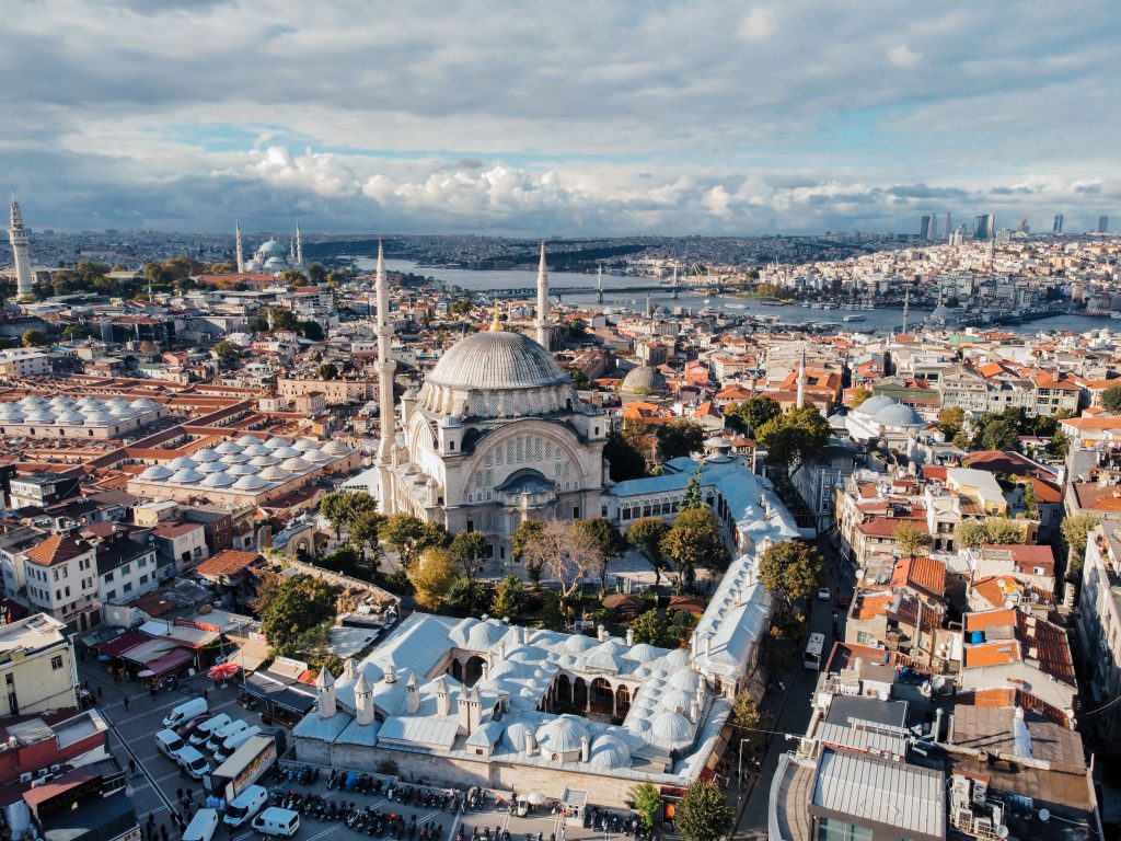 Experience the majestic Nurosmaniye Mosque and surrounding cityscape from above in Istanbul, Turkey.