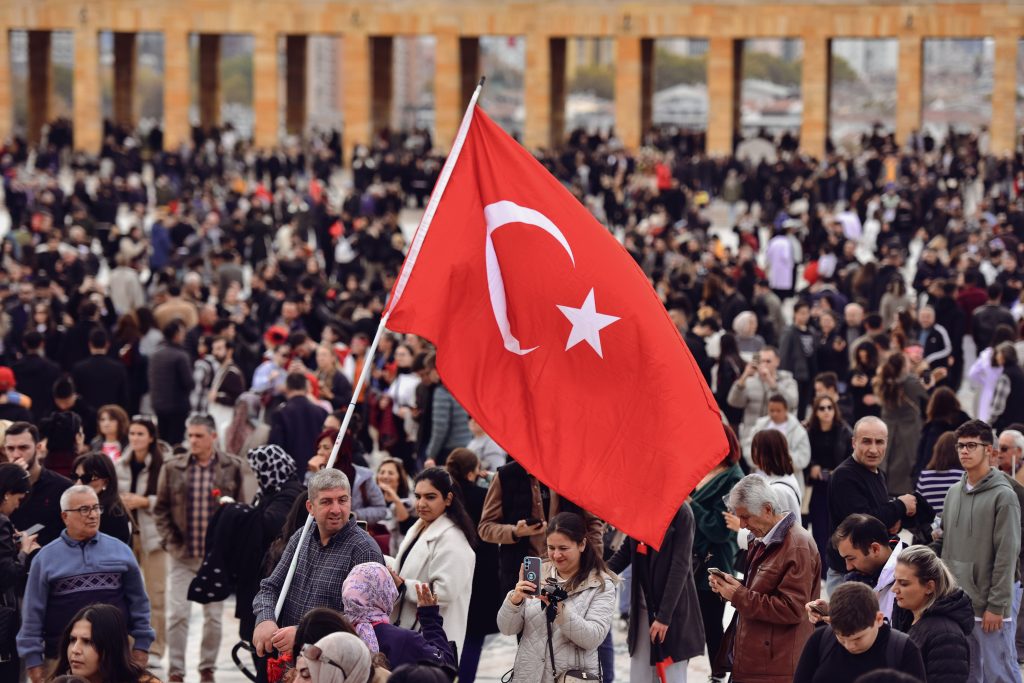 Vibrant crowd at Anıtkabir in Ankara, showcasing Turkish pride with the national flag prominently displayed.