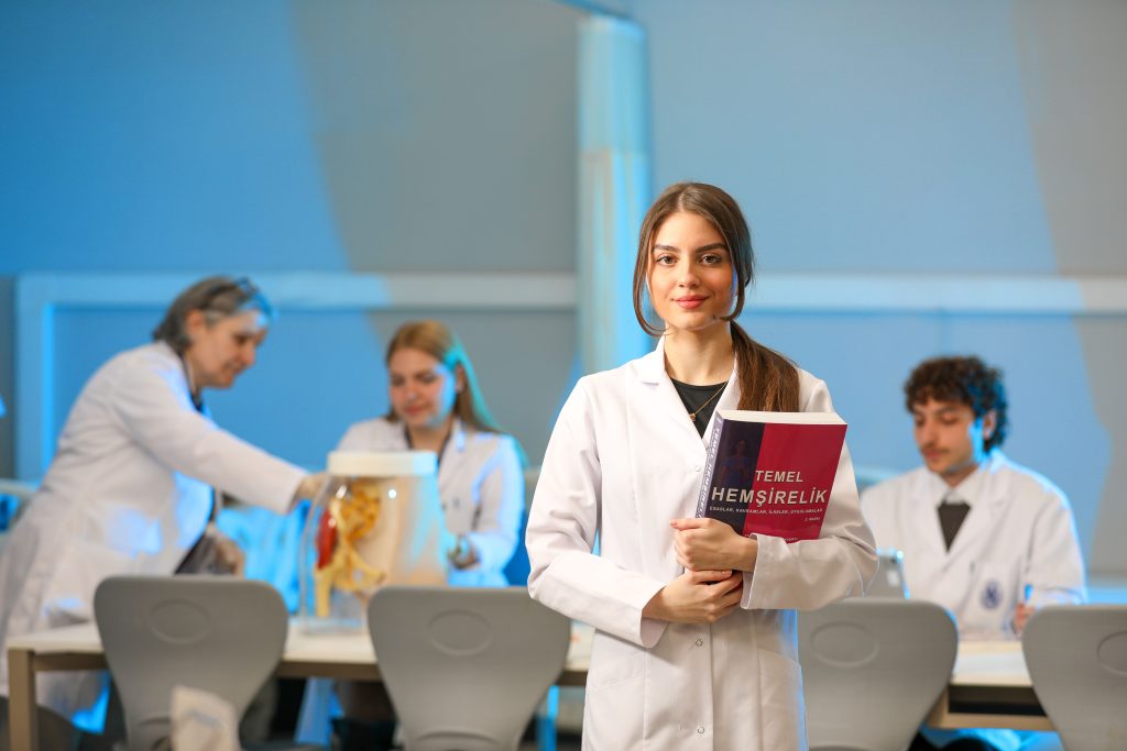 Young nursing students engaging in lab study, showcasing medical education.